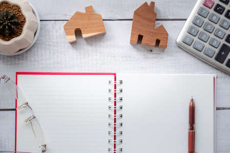 top view opened notebook with pen and stationary on wood texture backgroundの写真素材