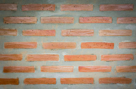 closeup orange classic brick wall texture for interiorの写真素材