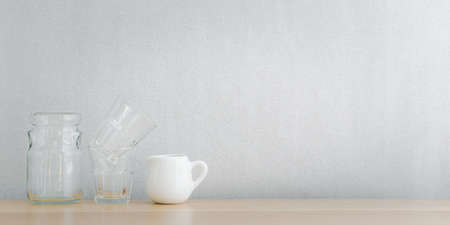kitchenware and utensils decorated on wooden shelf or counter with white wall background and copy space, home decorの写真素材