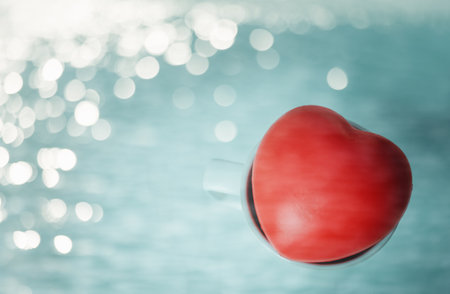 red rubber hearts in white mug with bokeh background, Valentine's day conceptの写真素材