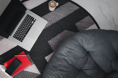 top view working equipments on floor with cushion, work from home during covid-19 conceptの写真素材