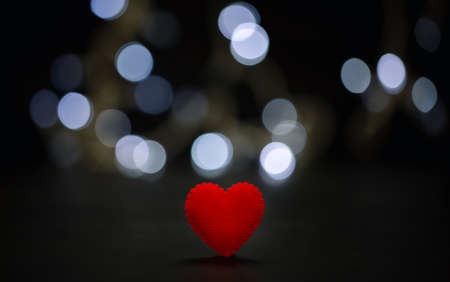 red heart with white bokeh on black background, Valentine's day conceptの写真素材