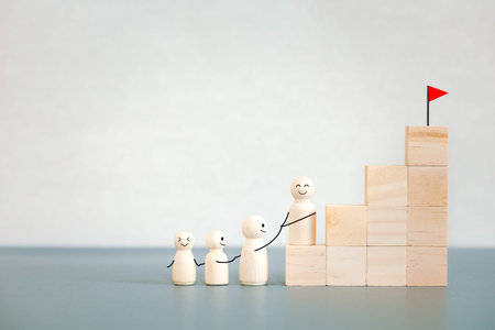 wooden doll family hold on together hiking for goal on top of wooden block steps, fighting for...