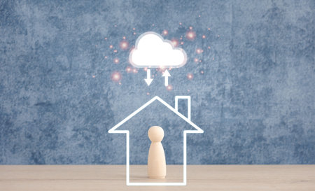 cloud computing above home icon and wooden doll on blue background, cloud storage and technology...