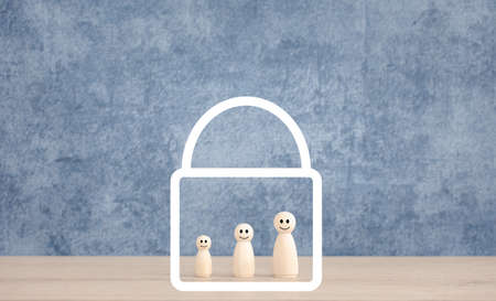 wooden dolls inside lock icon, lockdown for prevention conceptの写真素材
