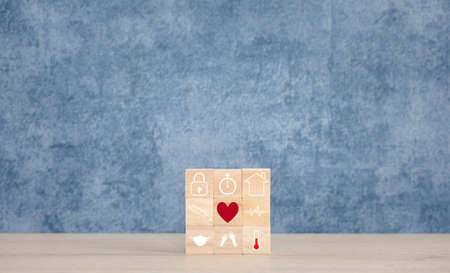 health icons on wood block for pandemic situation, healthcare and medical conceptの写真素材