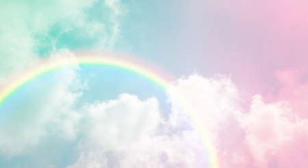texture of cloud with rainbow on pastel sky, blue and pink toneの写真素材