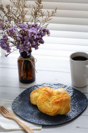 homemade coconut flake bread with hot coffeeの写真素材