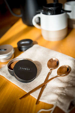 set of drip coffee on wood table with morning light, relax timeの写真素材