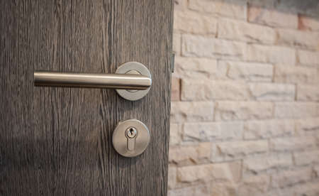 closeup handle on opened door, home interiorの写真素材