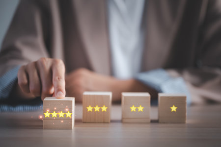 closeup businesswoman finger choosing 4 stars wooden cube rating, satisfactory survey concept
