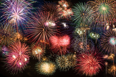 colorful fireworks fully in frame on black backgroundの写真素材