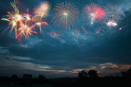 colorful fireworks on cloudy blue sky background