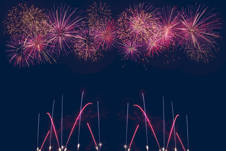 colorful fireworks display on dark blue background, celebration conceptの写真素材