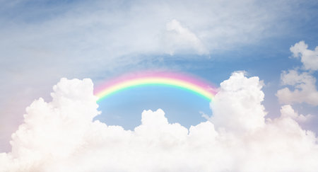 rainbow on cloudy blue sky , beautiful fantasy skyの写真素材