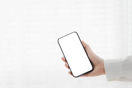 woman hand holding on blank white screen smartphone isolated on transparent curtain white background, technology conceptの写真素材