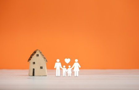 home sweet home, home model with family icon on orange color backgroundの写真素材
