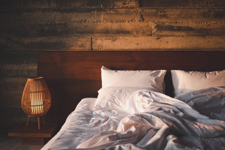 closeup messy bedding in the morningの写真素材