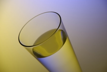 Water in the thin glass with colorful backgroundの写真素材