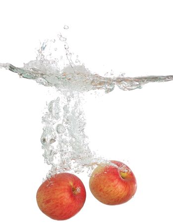 Two Apple fall into waterの写真素材