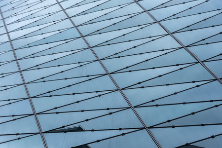 Semi-exposed Framing Glass Gurtain Wall. Triangular glass curtain wall.の写真素材