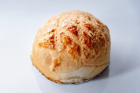 Pineapple bun isolated on white background. Hong Kong dim sum. Cantonese cuisine.の写真素材