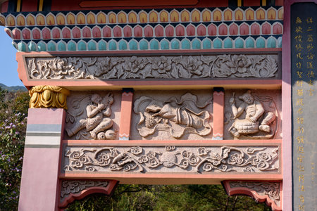 The relief sculptures on the memorial archway of Huanglong Ancient Taoist Temple in Luofu Mountain, Boluo County, Huizhou City, Guangdong Province, china.の写真素材