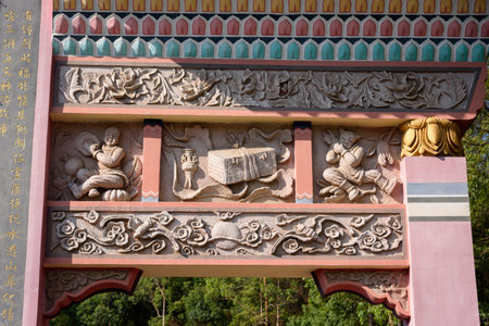 The relief sculptures on the memorial archway of Huanglong Ancient Taoist Temple in Luofu Mountain, Boluo County, Huizhou City, Guangdong Province, china.の写真素材