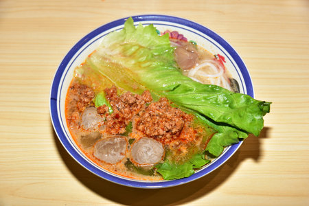 Rice Noodles with Beef Tendon Balls and Minced Meat Sauce. Chinese cuisine.