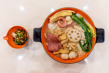 Improved version of spicy hot pot and sauces. A bowl of cooked assorted vegetables and meats. Chinese food.の写真素材
