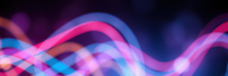 Colorful light patterns create a vibrant atmosphere at a nighttime event in a city settingの素材