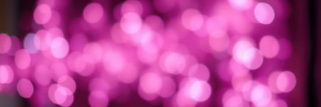 Vibrant pink bokeh lights create a dreamy atmosphere during a festive celebration at nightの素材