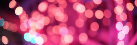 Vibrant colors blend together in an abstract display of festive lights at nightの素材