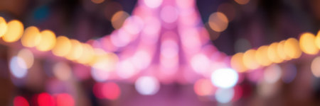 Colorful lights illuminate a vibrant street market at night, creating a festive atmosphere with soft bokeh effectsの素材