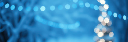 Soft blue lights adorn a festive winter landscape enhancing holiday cheer at nightの素材