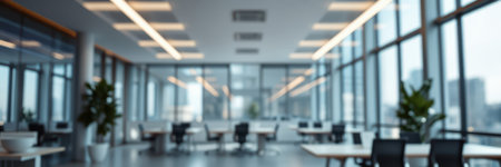 Modern office space with large windows offering city views and a spacious layout for collaborative work activitiesの素材