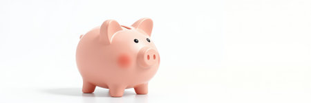 Piggy bank in soft pink color placed on a simple white backgroundの素材
