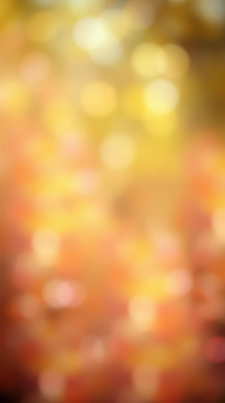 Soft golden hues create an abstract autumn atmosphere with blurred bokeh effects in a peaceful settingの素材