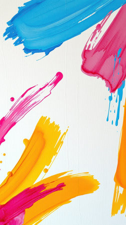Colorful splashes of paint create an abstract artwork on a white canvas in a creative studioの素材