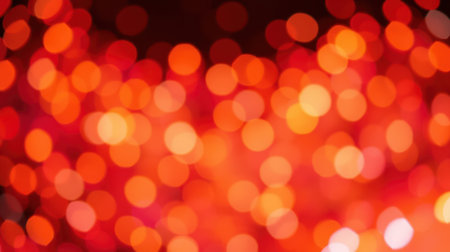 Vibrant red bokeh lights create an enchanting background for festive occasions or intimate gatheringsの素材