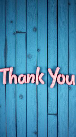 Brightly colored thank you message on blue wooden background for expressing gratitude in various settingsの素材