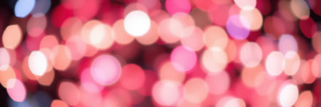 Colorful bokeh lights create a festive atmosphere for a celebration at nightの素材