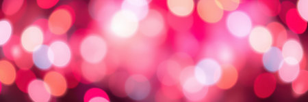 Abstract bokeh lights create a vibrant atmosphere with shades of pink, purple, and white shimmering in the backgroundの素材