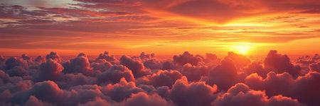 A vast expanse of clouds stretches below a vibrant sunsetの素材