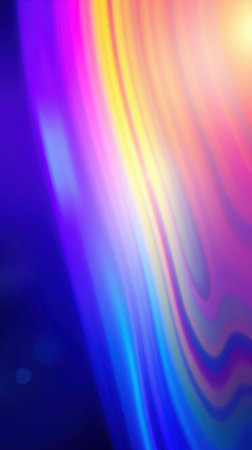 Vibrant abstract waves blend colorful hues in a flowing design showing movement and creativityの素材