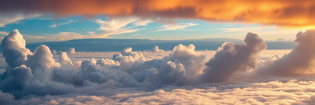 A beautiful view of fluffy clouds at sunset, taken from an airplaneの素材