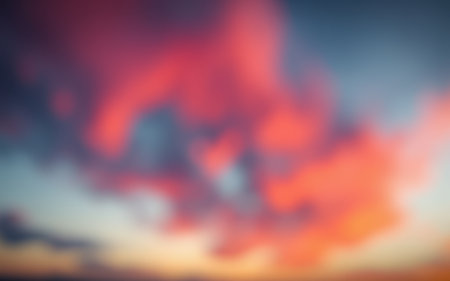 Vibrant sunset clouds over a serene landscape with soft hues and beautiful color transitions at duskの素材