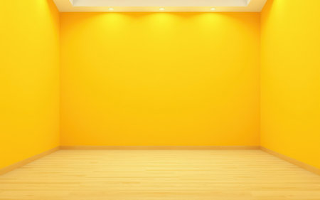 Bright yellow room with wooden floor and warm lighting creating a cheerful atmosphere for various activitiesの素材