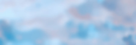 Cloudy sky with soft blue and gray hues during late afternoon in a serene landscape settingの素材