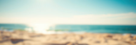 Soft light over serene beach with distant ocean waves during early evening hoursの素材